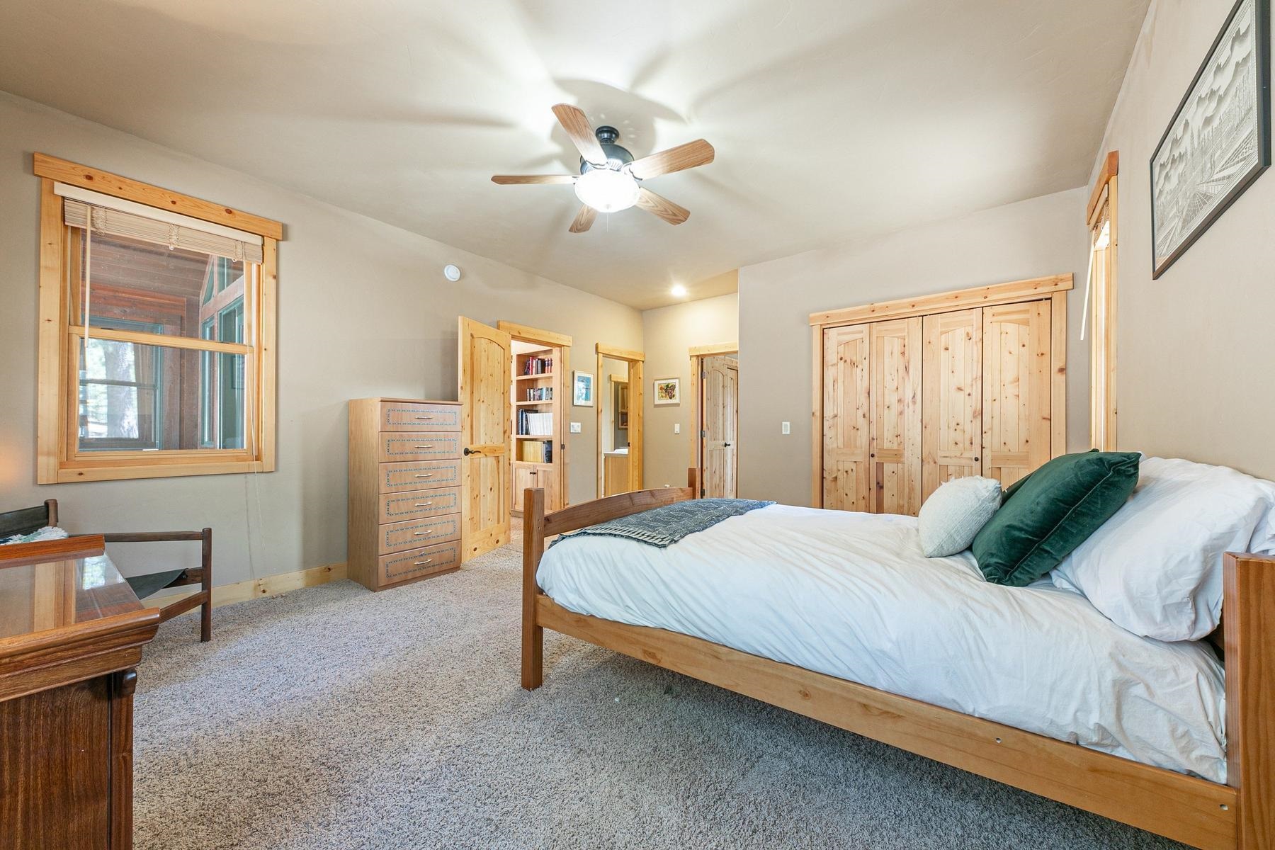 14070 Alder Creek Road Truckee, CA 96161 - Photo 13 of 28 a bedroom with a bed dresser and a window