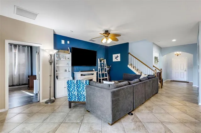 a living room with furniture and a flat screen tv