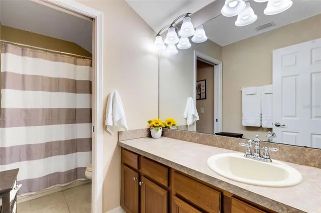 a bathroom with a sink double vanity and a mirror