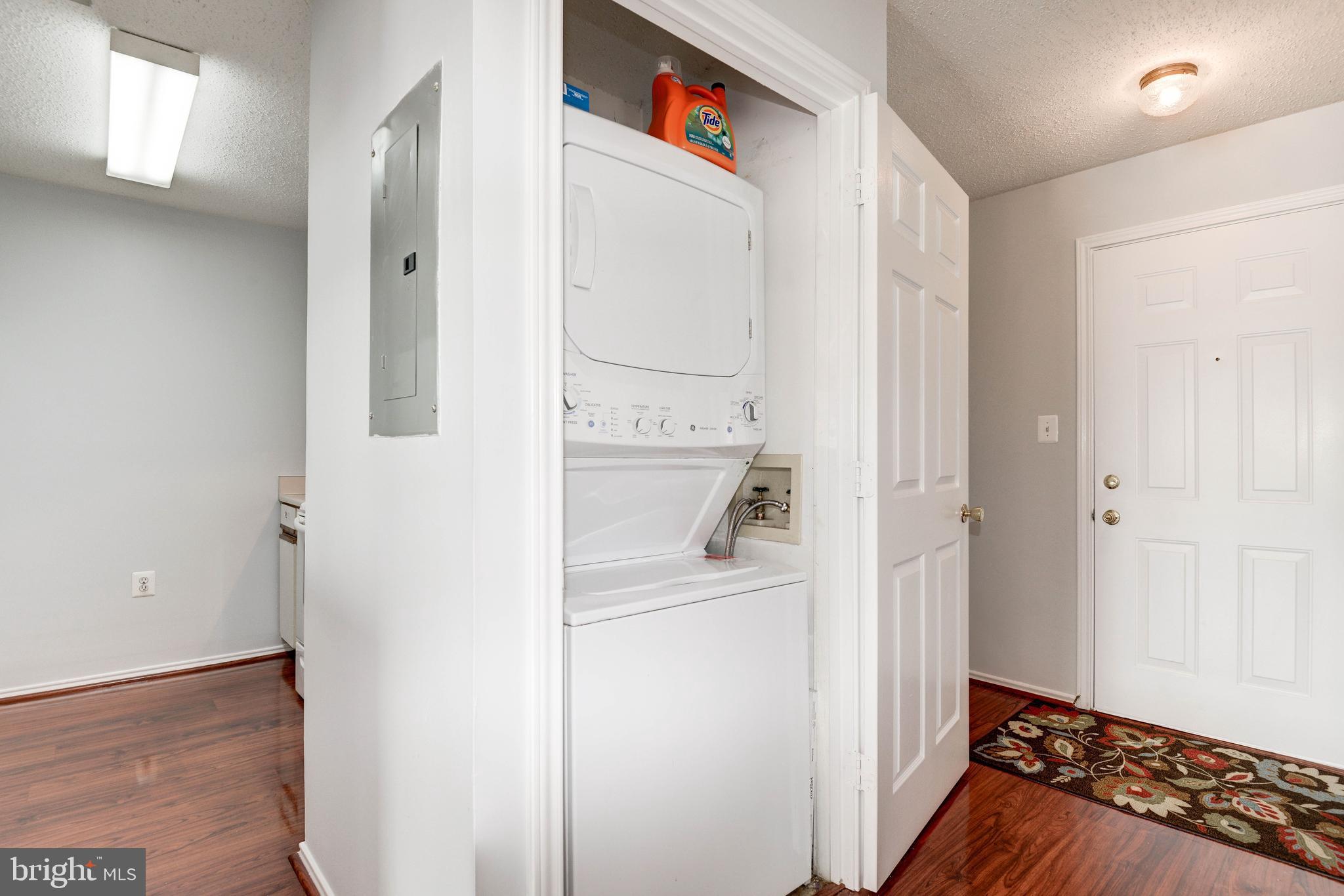 20979 Timber Ridge Terrace, Unit 303 Ashburn, VA 20147 - Photo 3 of 23 Front entrance and clothes washer/dryer