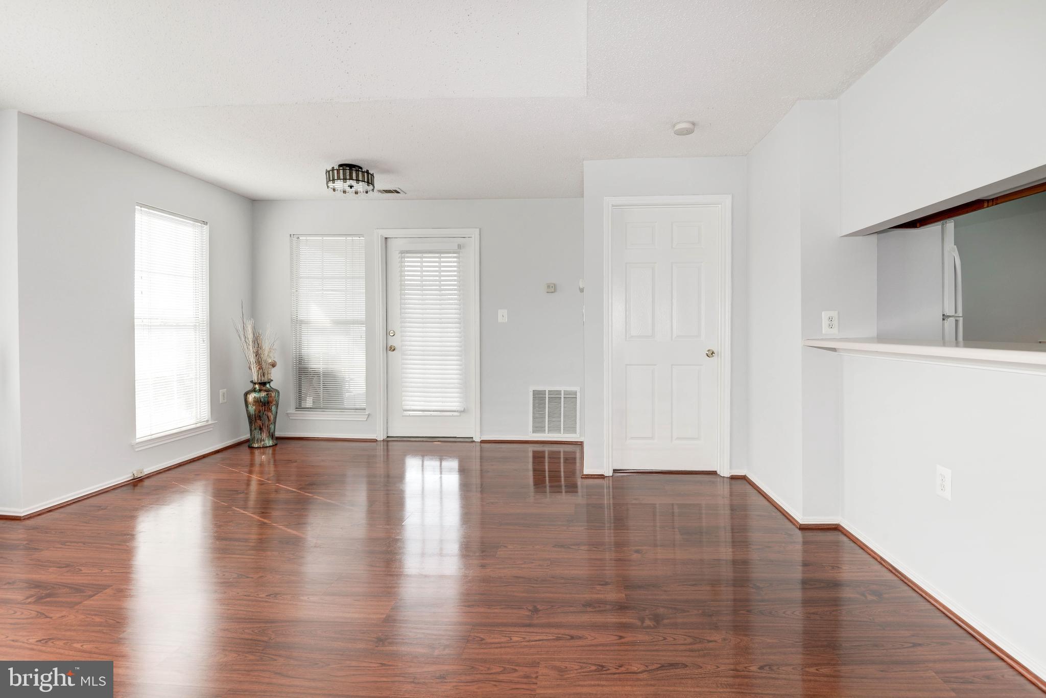 20979 Timber Ridge Terrace, Unit 303 Ashburn, VA 20147 - Photo 4 of 23 living/dining area