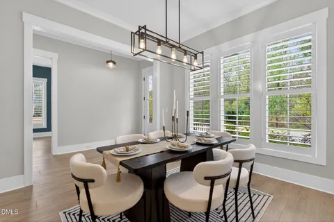 a view of a livingroom with furniture window and wooden floor