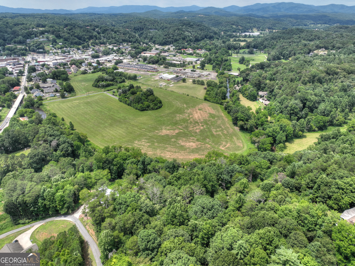 Lot 4 Mountain Trace Ellijay, GA 30540 - Photo 11 of 16 an aerial view of residential houses with outdoor space and trees