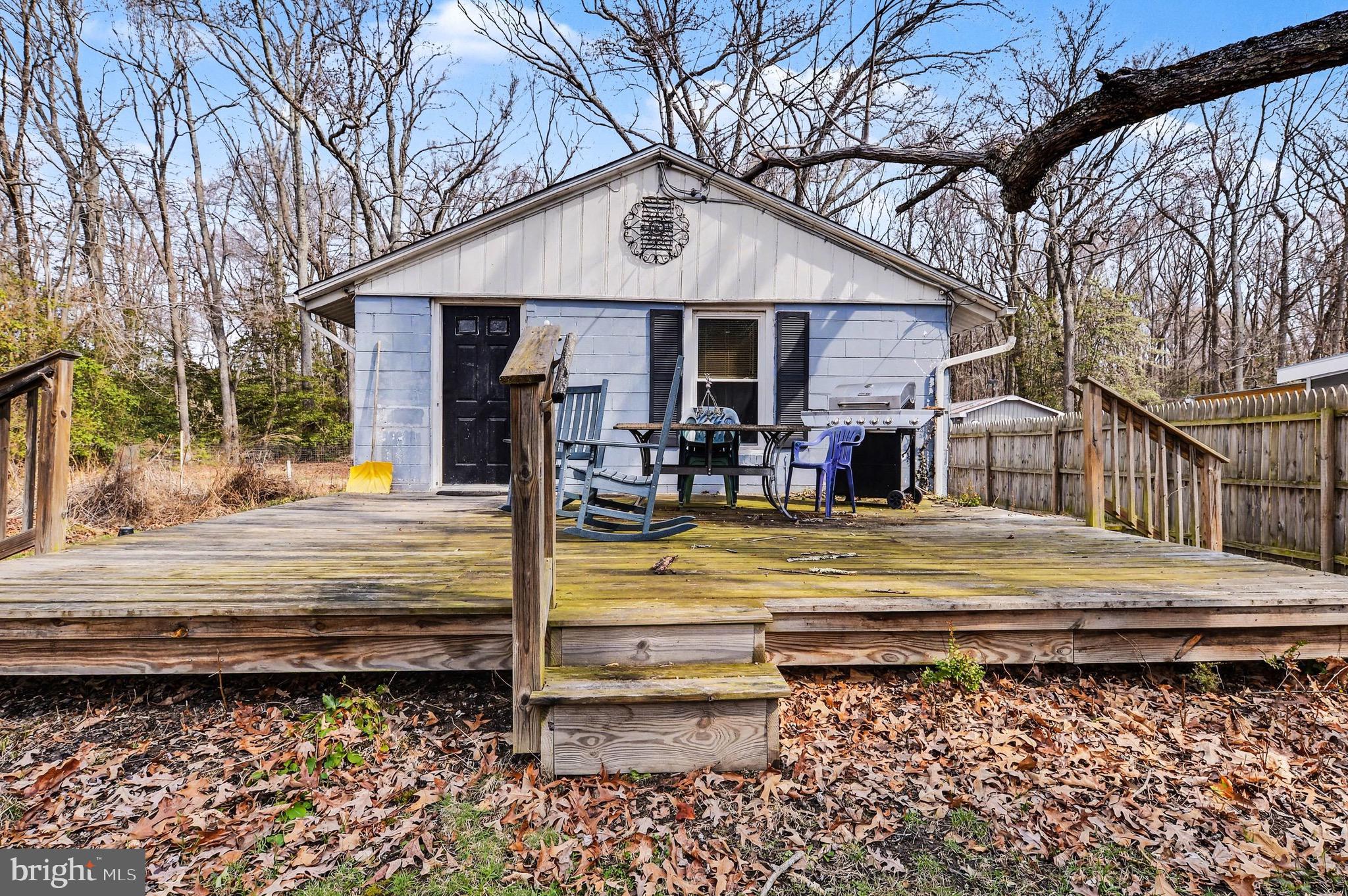1220 Shesley Road Edgewater, MD 21037 - Photo 1 of 22 a view of a house with a wooden floor next to a yard