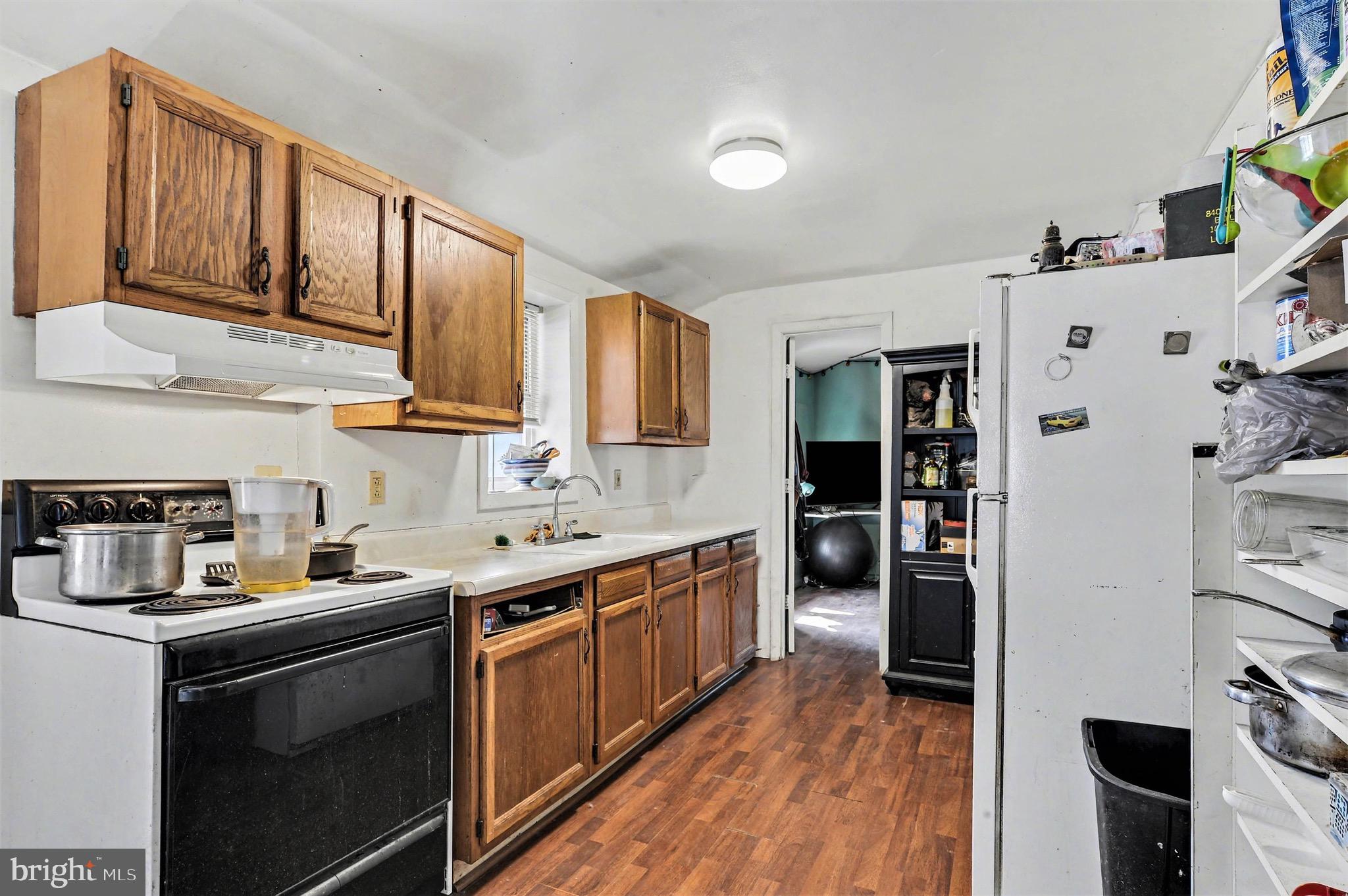 1220 Shesley Road Edgewater, MD 21037 - Photo 11 of 22 a kitchen with a sink stove and cabinets