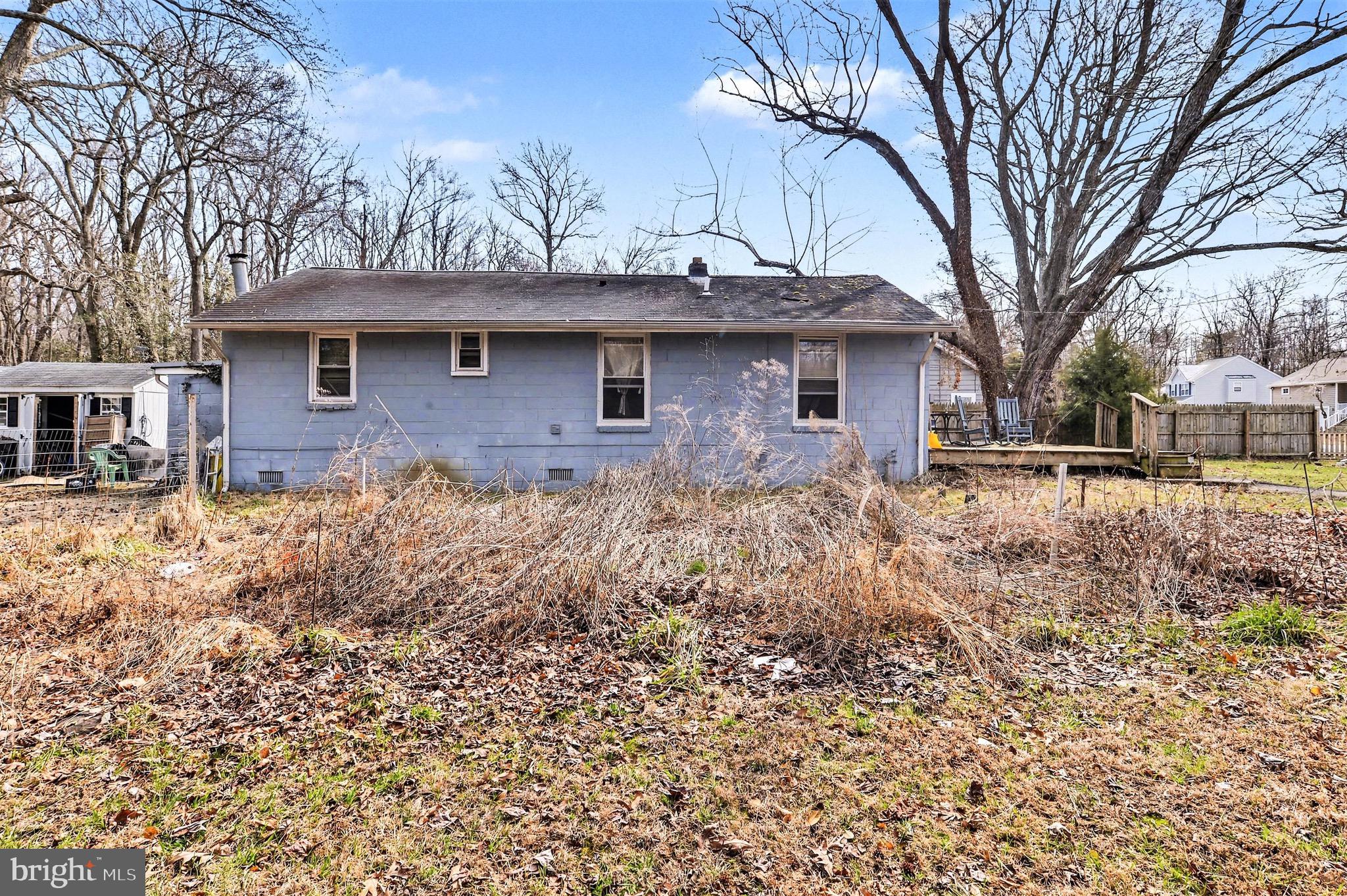 1220 Shesley Road Edgewater, MD 21037 - Photo 19 of 22 a front view of a house with a yard