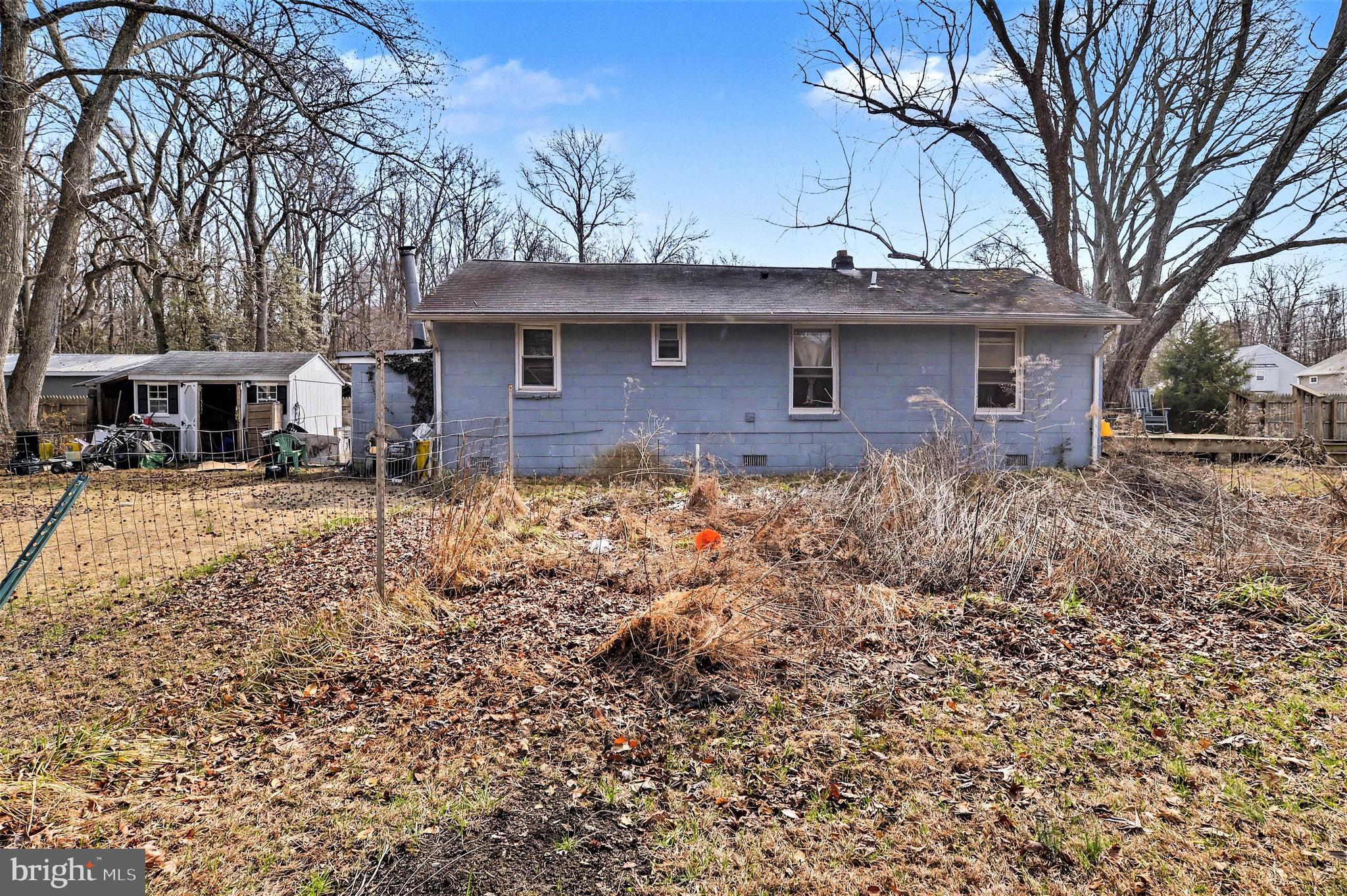 1220 Shesley Road Edgewater, MD 21037 - Photo 20 of 22 a front view of a house with garden