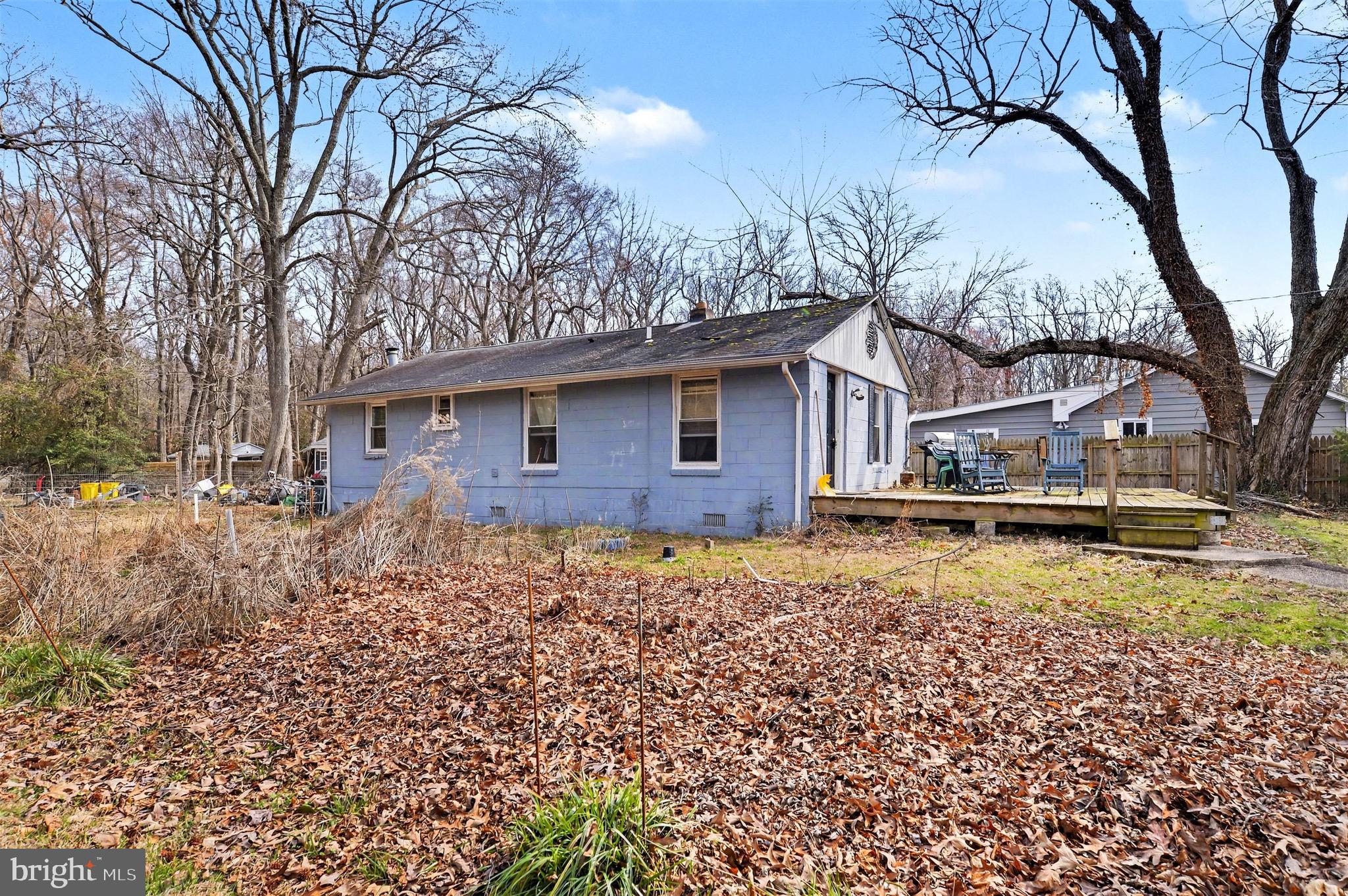 1220 Shesley Road Edgewater, MD 21037 - Photo 21 of 22 a view of a house with a yard covered with snow
