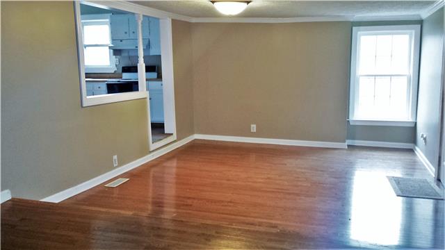 290 Cottage Home Road Liberty, TN 37095 - Photo 2 of 15 a view of a room with wooden floor and windows