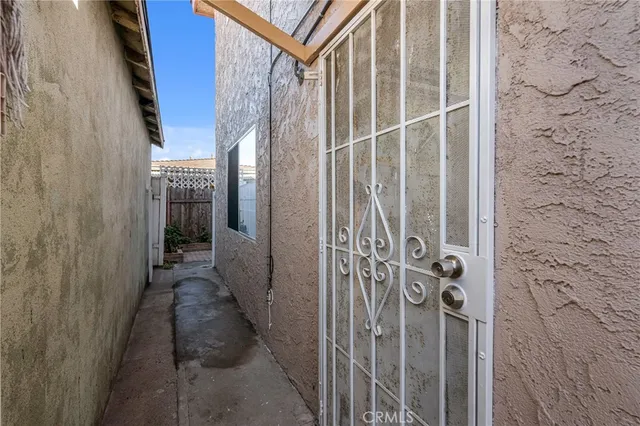 a kitchen with stainless steel appliances granite countertop a stove and a white cabinets
