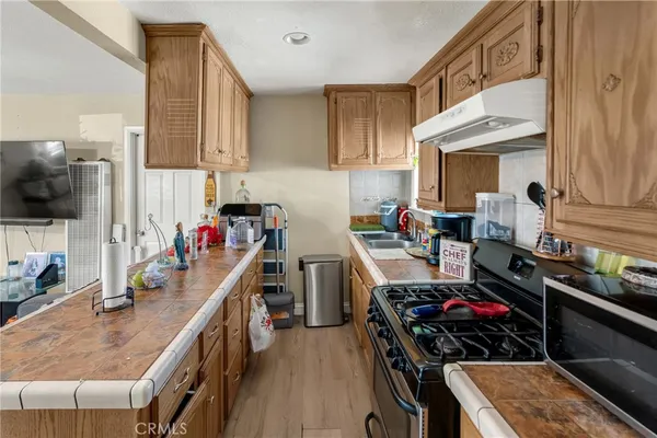 a kitchen with a stove and a sink