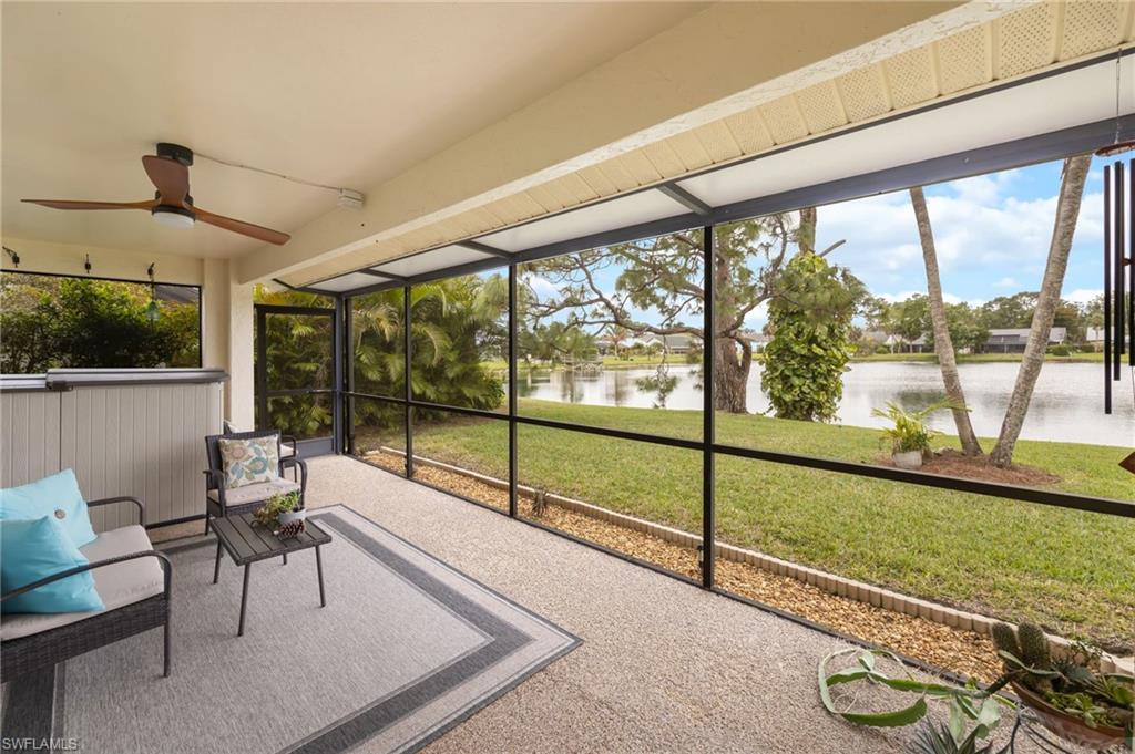 1324 Monarch Circle Naples, FL 34116 - Photo 18 of 23 a living room with hardwood floor and a large window