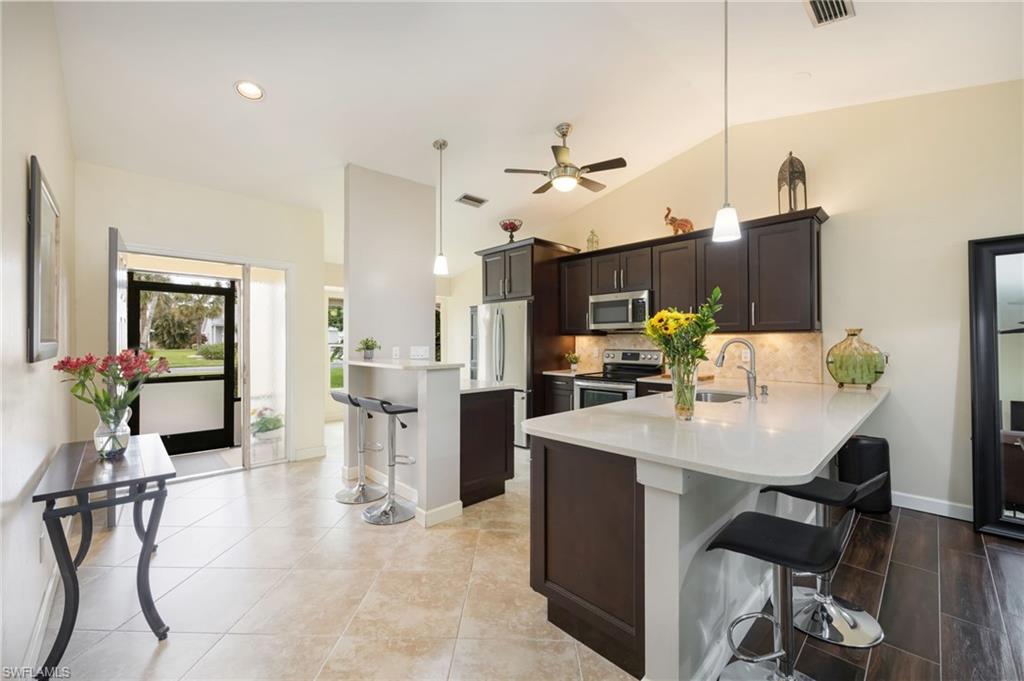 1324 Monarch Circle Naples, FL 34116 - Photo 4 of 23 a view of kitchen dining table and chairs