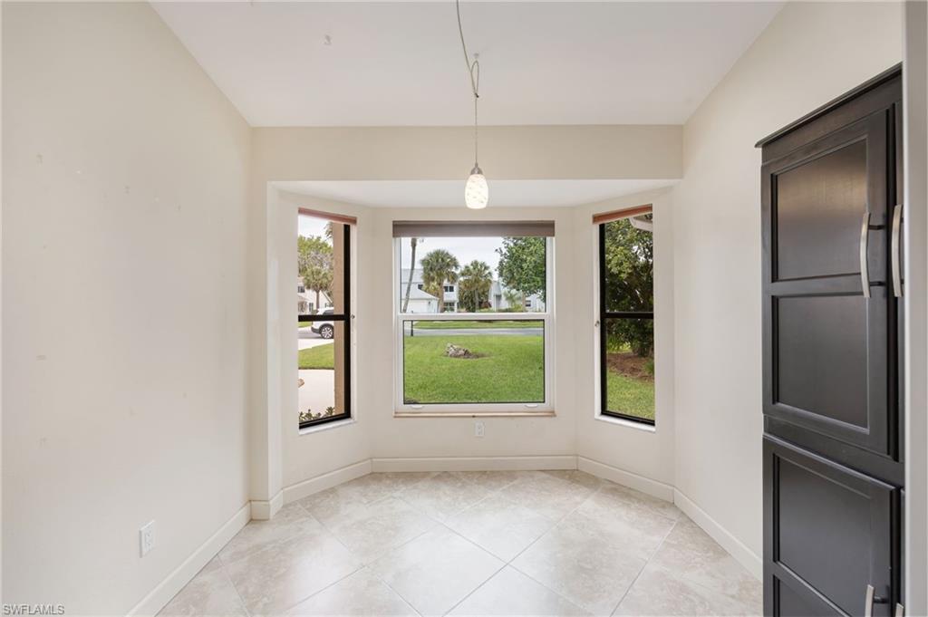 1324 Monarch Circle Naples, FL 34116 - Photo 6 of 23 a view of an empty room with a window