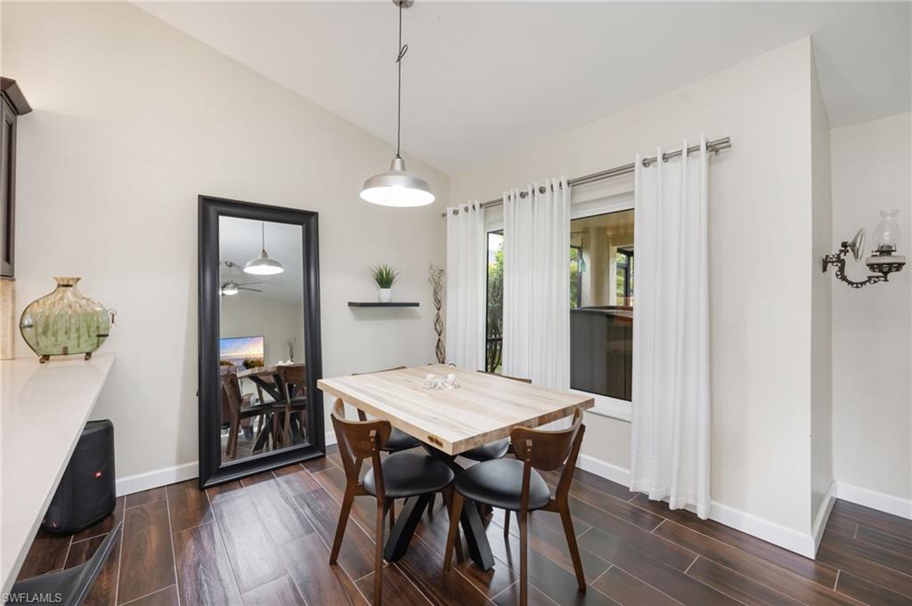 1324 Monarch Circle Naples, FL 34116 - Photo 7 of 23 a view of a dining room with furniture and wooden floor