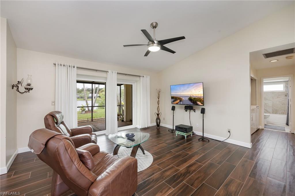 1324 Monarch Circle Naples, FL 34116 - Photo 9 of 23 a living room with furniture and a window