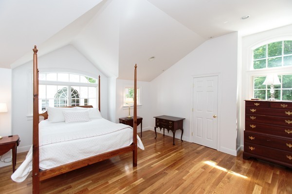 6 Bay State Road Wellesley, MA 02481 - Photo 14 of 18 a bedroom with a bed and wooden floor