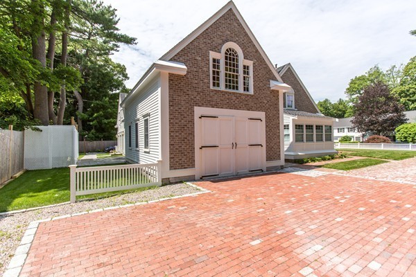 6 Bay State Road Wellesley, MA 02481 - Photo 17 of 18 a front view of a house with a yard and garage