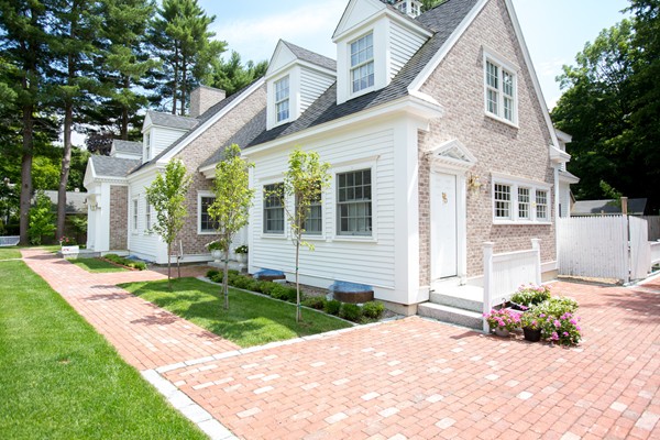6 Bay State Road Wellesley, MA 02481 - Photo 2 of 18 a front view of a house with a yard and potted plants
