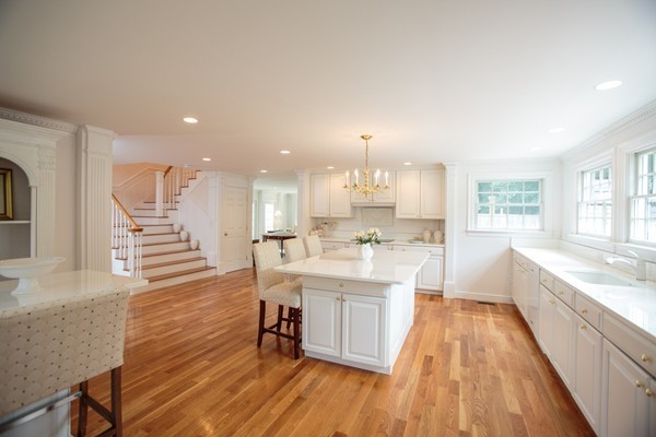 6 Bay State Road Wellesley, MA 02481 - Photo 6 of 18 a large kitchen with cabinets wooden floor and stainless steel appliances