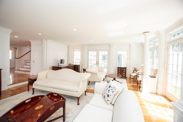 6 Bay State Road Wellesley, MA 02481 - Photo 7 of 18 a large bedroom with a bed and large windows