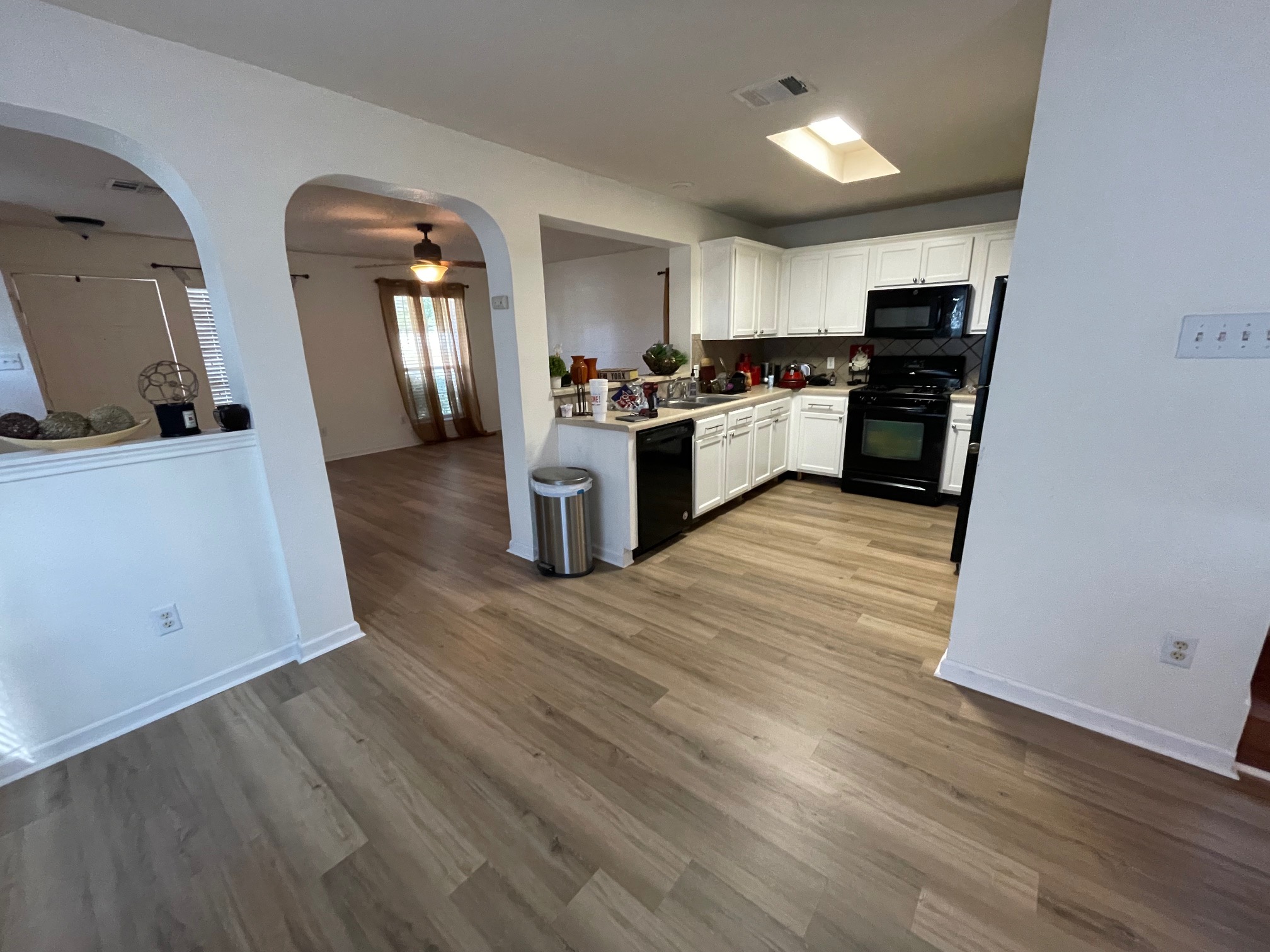 1000 Berry Bend Path Round Rock, TX 78664 - Photo 20 of 20 An open floorplan connecting living spaces, featuring resilient flooring and a well-appointed kitchen.