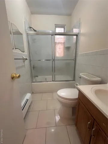 a bathroom with a toilet a sink and shower