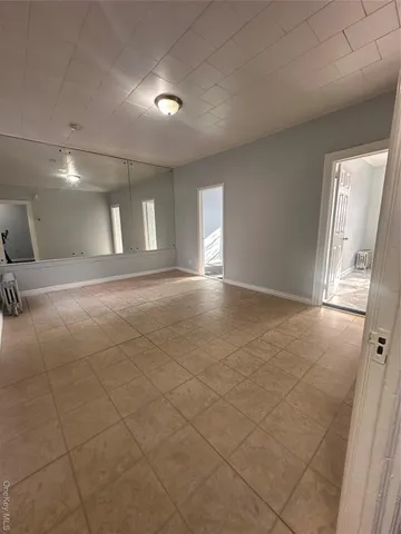 a view of an empty room and a windows