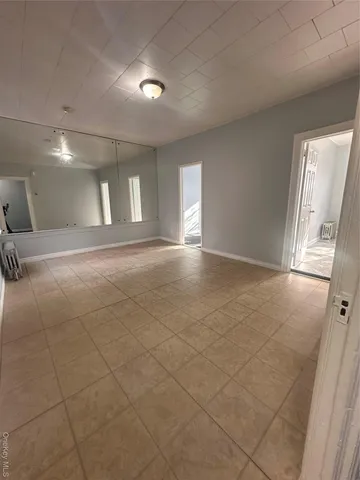 a view of an empty room and a windows