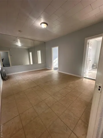 a view of an empty room and a windows