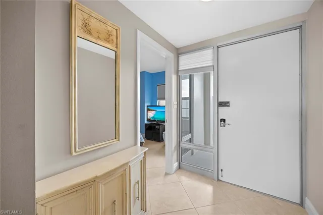 a view of a hallway with closet and bathroom