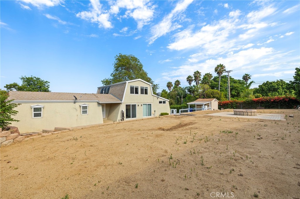 410 Palomino Road Fallbrook, CA 92028 - Photo 14 of 25 a front view of a house with a yard