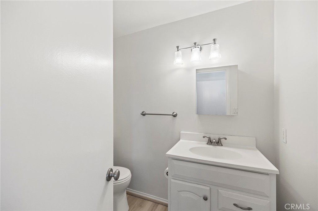 410 Palomino Road Fallbrook, CA 92028 - Photo 8 of 25 a bathroom with a sink and a mirror
