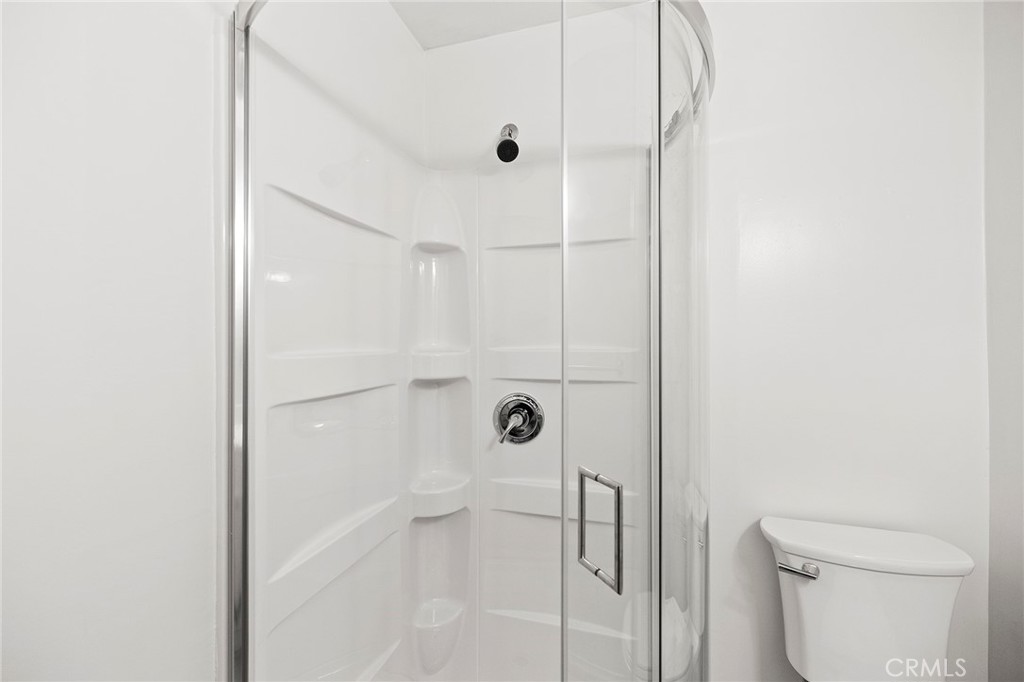 410 Palomino Road Fallbrook, CA 92028 - Photo 9 of 25 a bathroom with a shower and toilet