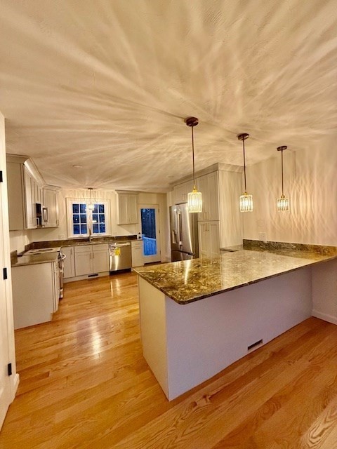 38 Colonial Road Webster, MA 01570 - Photo 11 of 33 a kitchen with stainless steel appliances granite countertop a sink and counter space