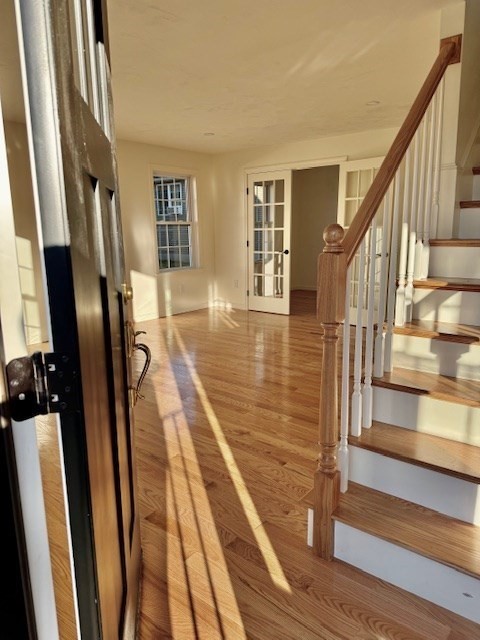 38 Colonial Road Webster, MA 01570 - Photo 6 of 33 a view of entryway with wooden floor and stairs