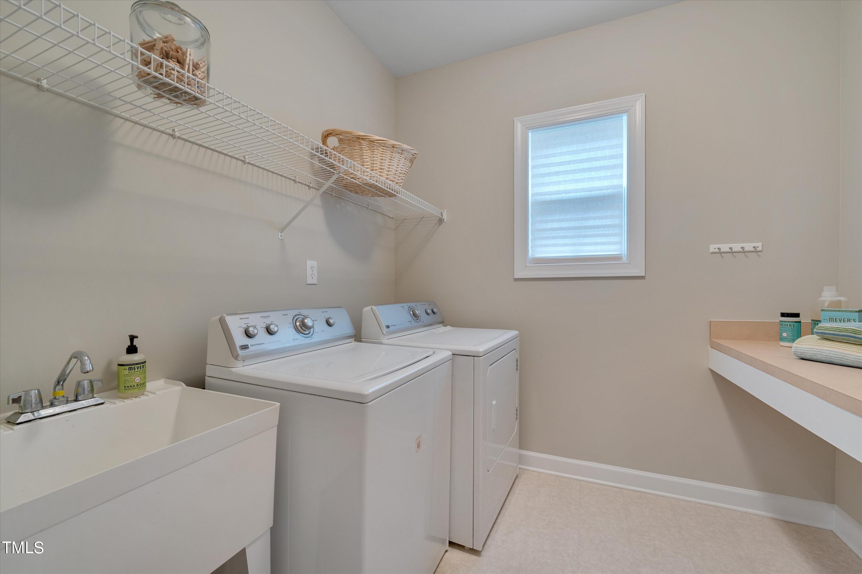 518 Panthers Run Drive Durham, NC 27713 - Photo 19 of 39 a utility room with dryer and washer