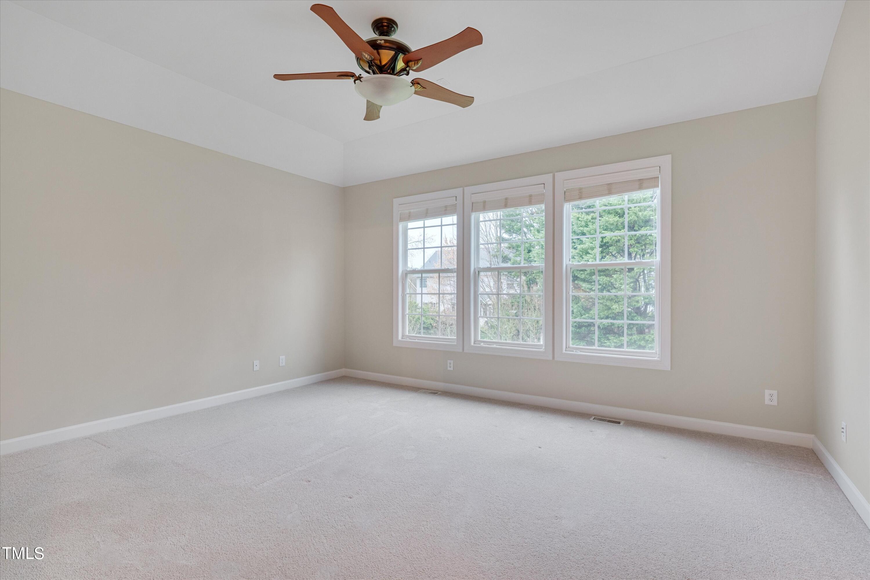 518 Panthers Run Drive Durham, NC 27713 - Photo 20 of 39 an empty room with a window and a fan
