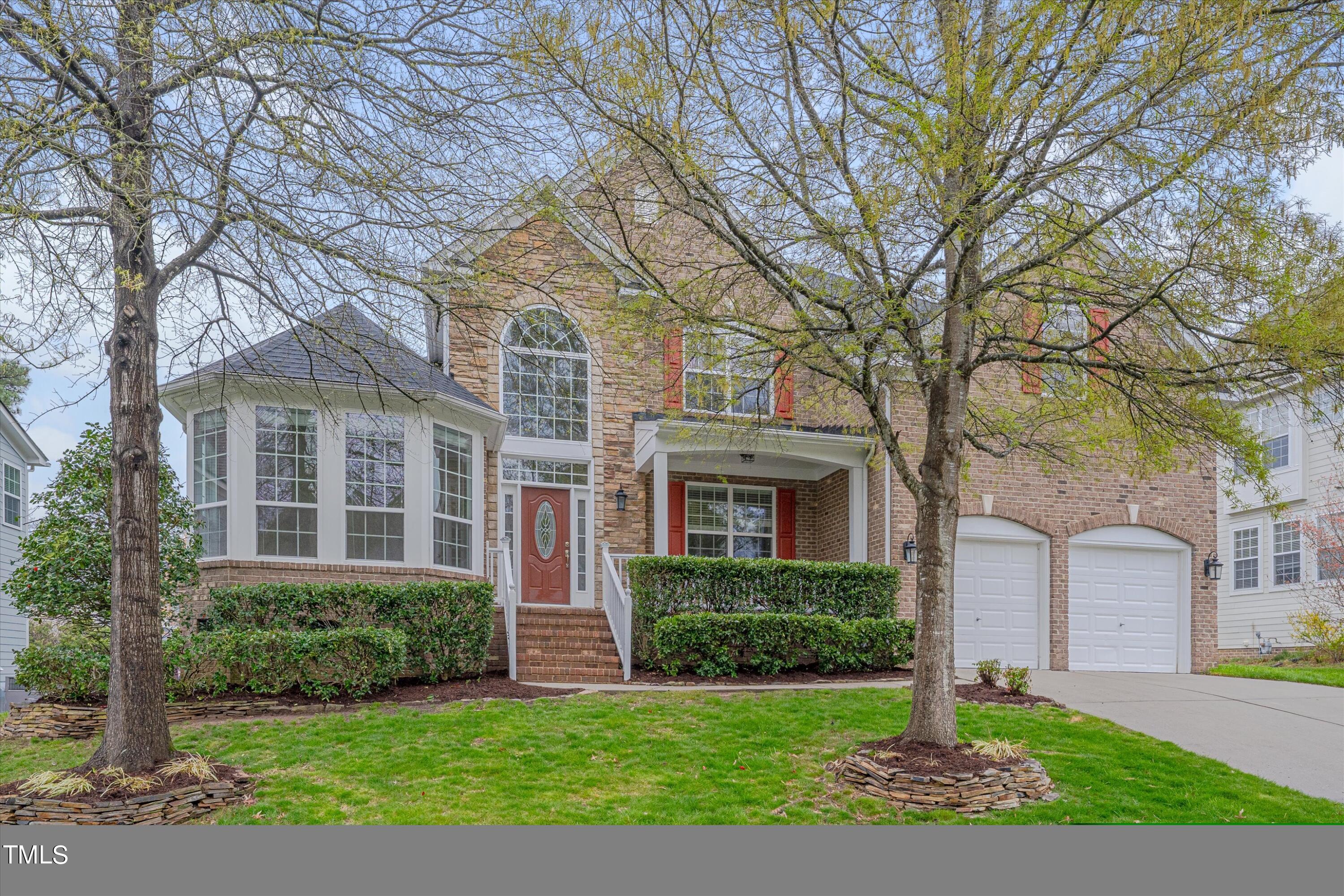 518 Panthers Run Drive Durham, NC 27713 - Photo 2 of 39 a front view of a house with a yard and trees