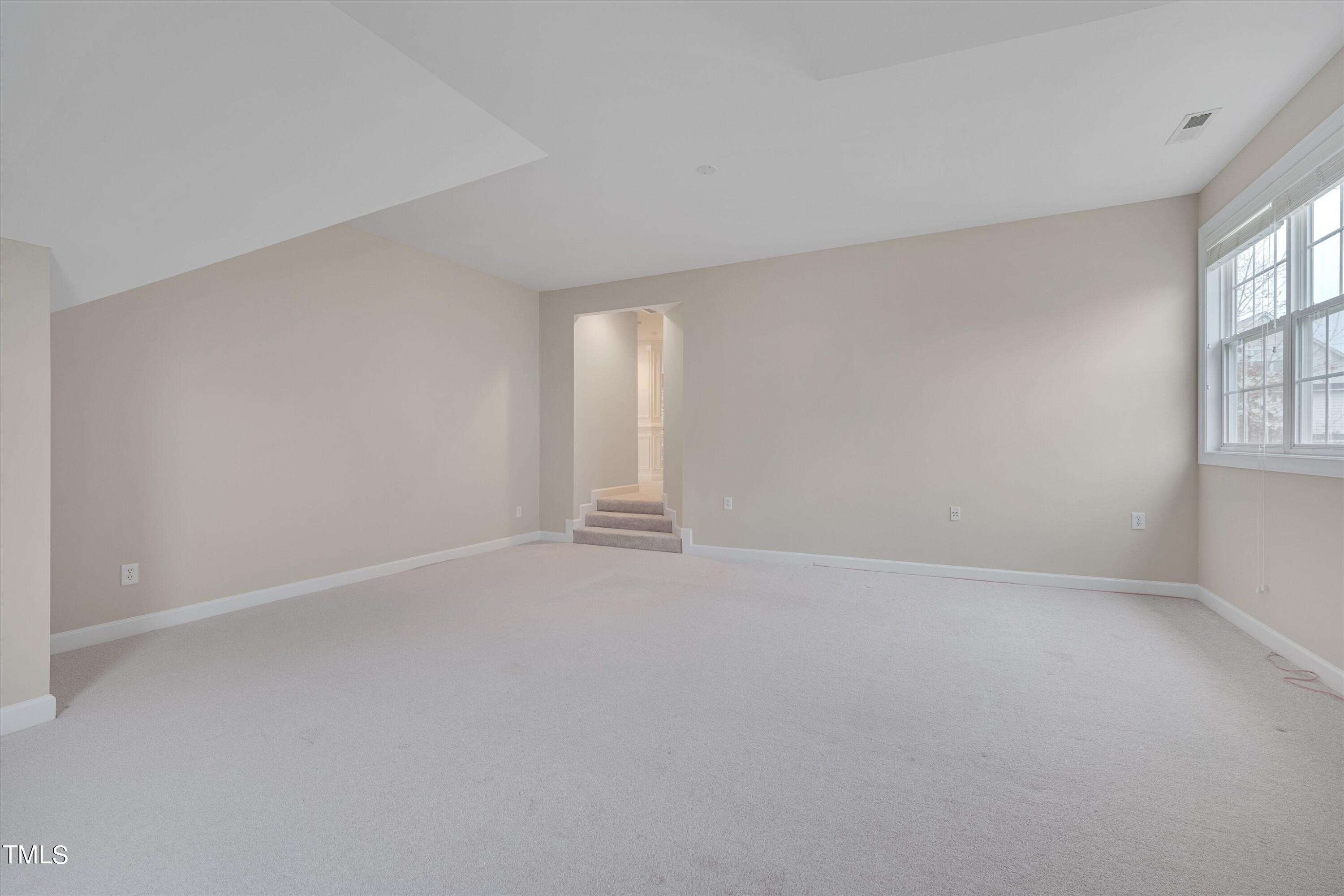 518 Panthers Run Drive Durham, NC 27713 - Photo 28 of 39 a view of an empty room with a window