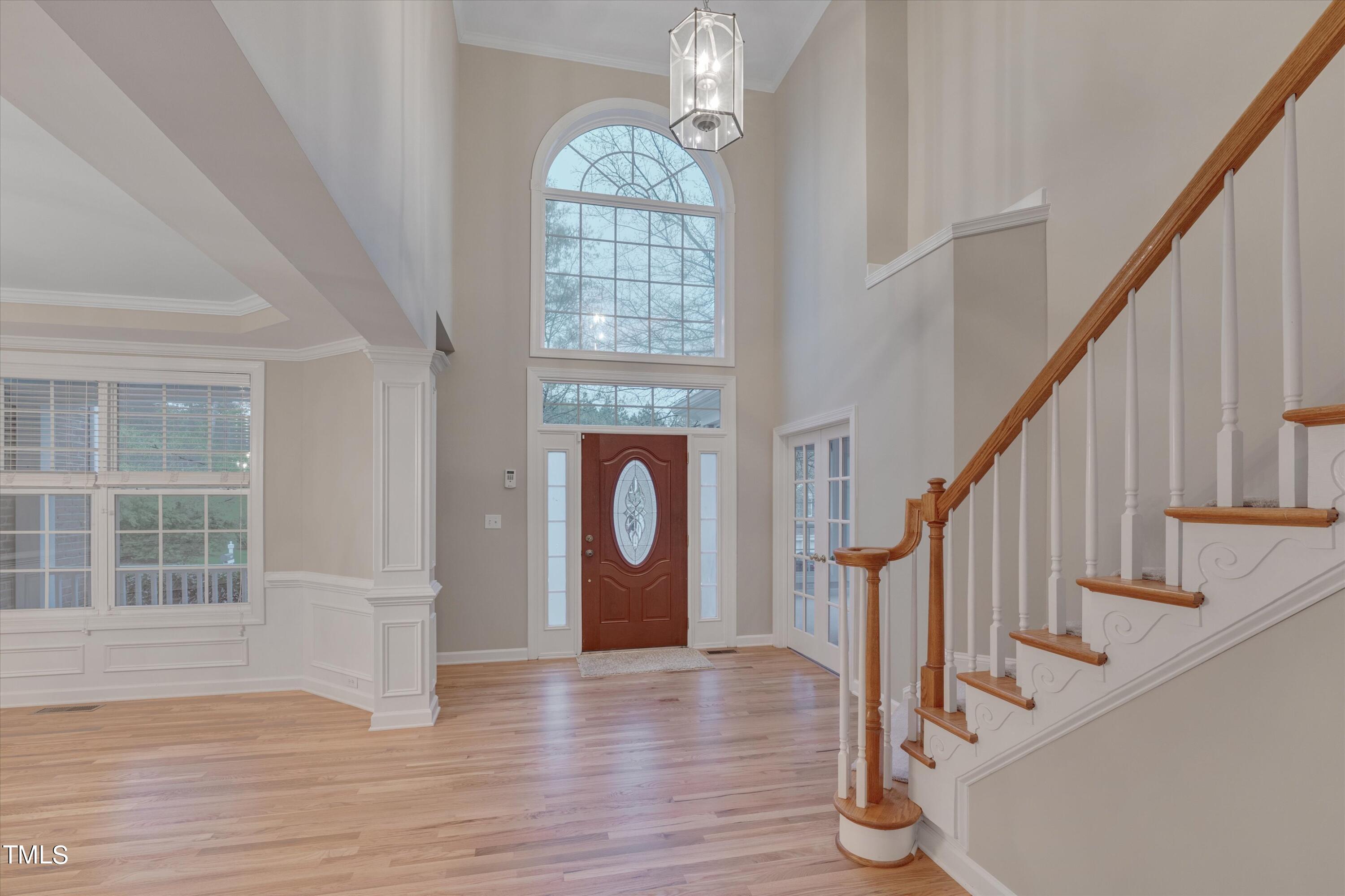 518 Panthers Run Drive Durham, NC 27713 - Photo 5 of 39 a view of entryway with wooden floor and stair