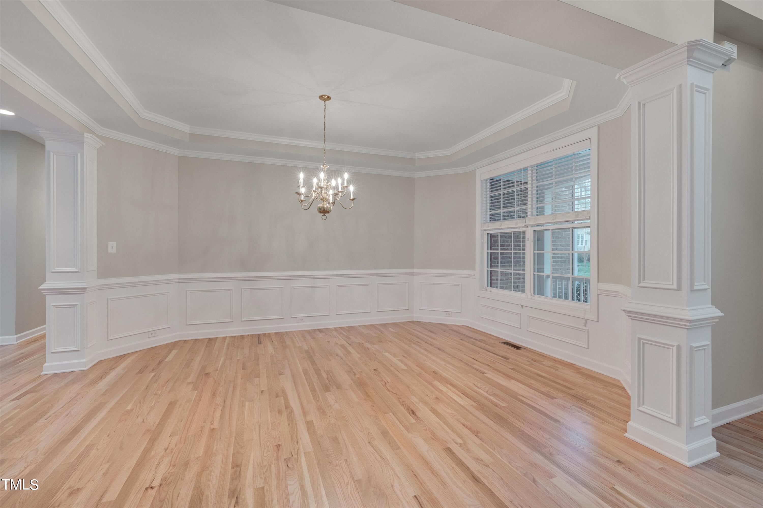 518 Panthers Run Drive Durham, NC 27713 - Photo 8 of 39 wooden floor in an empty room with a window