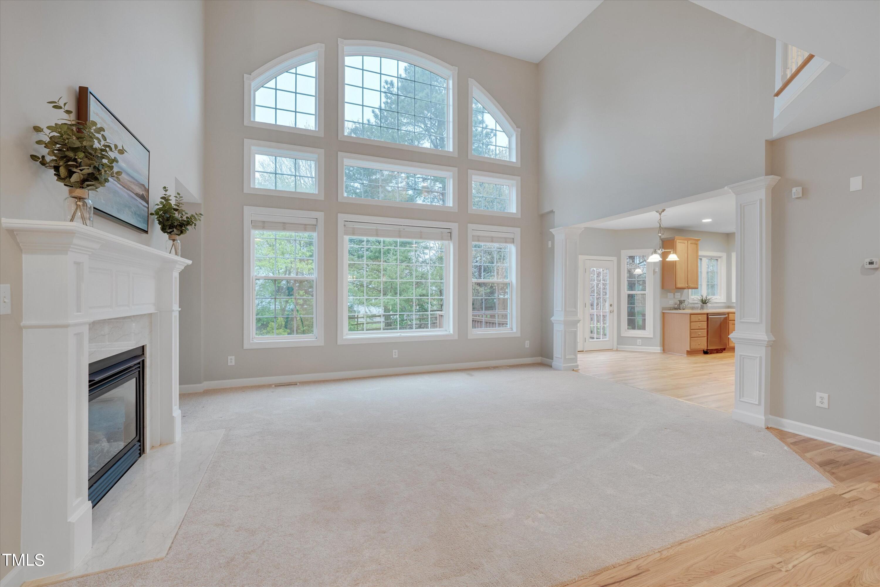 518 Panthers Run Drive Durham, NC 27713 - Photo 9 of 39 a view of an empty room with a fireplace and a window