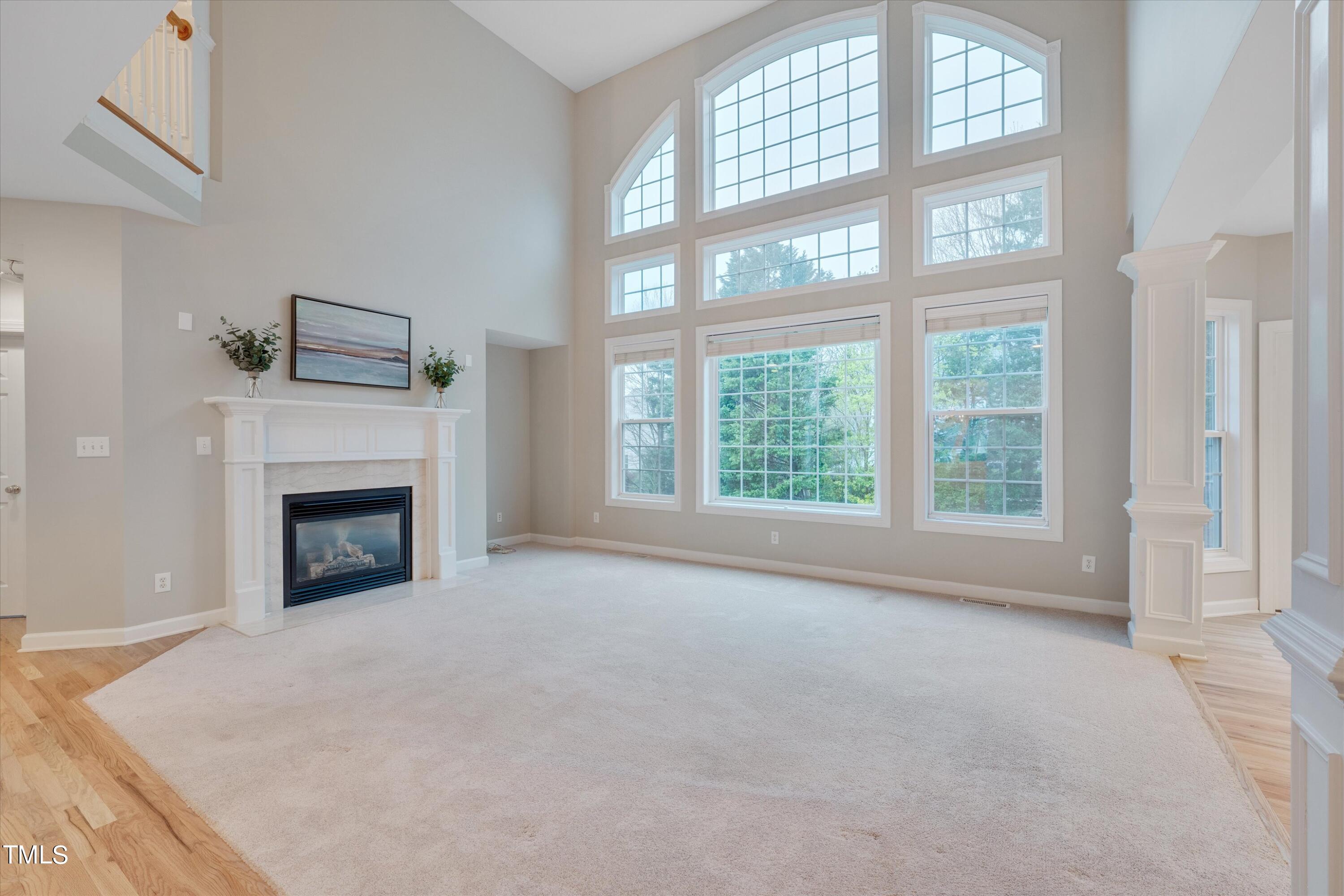 518 Panthers Run Drive Durham, NC 27713 - Photo 10 of 39 a view of an empty room with a fireplace and a window