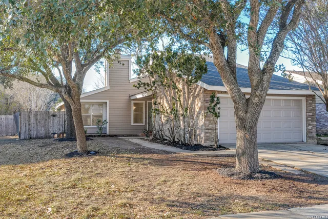 a house with trees in front of it