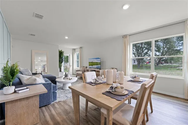 a living room with lots of furniture and white walls