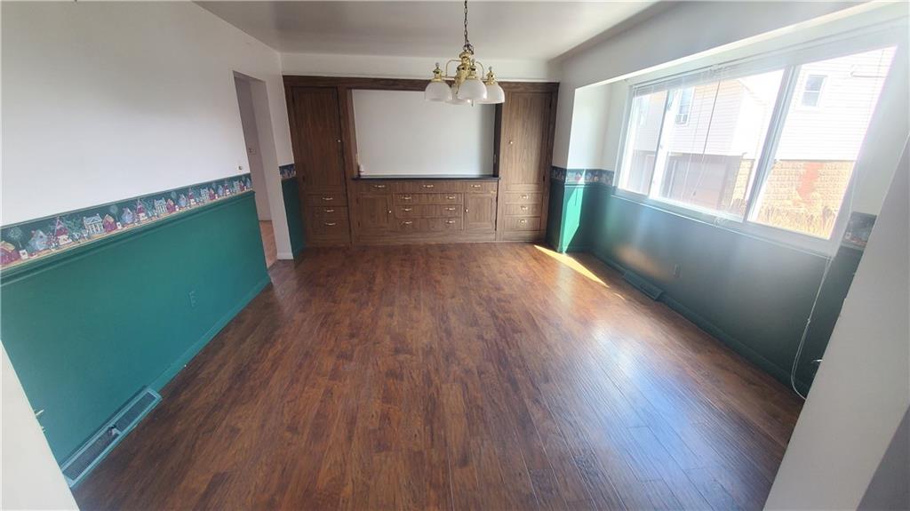 936 Ormond Street Brackenridge, PA 15014 - Photo 12 of 24 a view of a room with wooden floor and windows