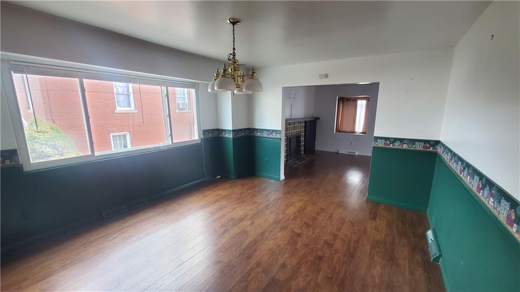 936 Ormond Street Brackenridge, PA 15014 - Photo 13 of 24 a view of an empty room with window and wooden floor