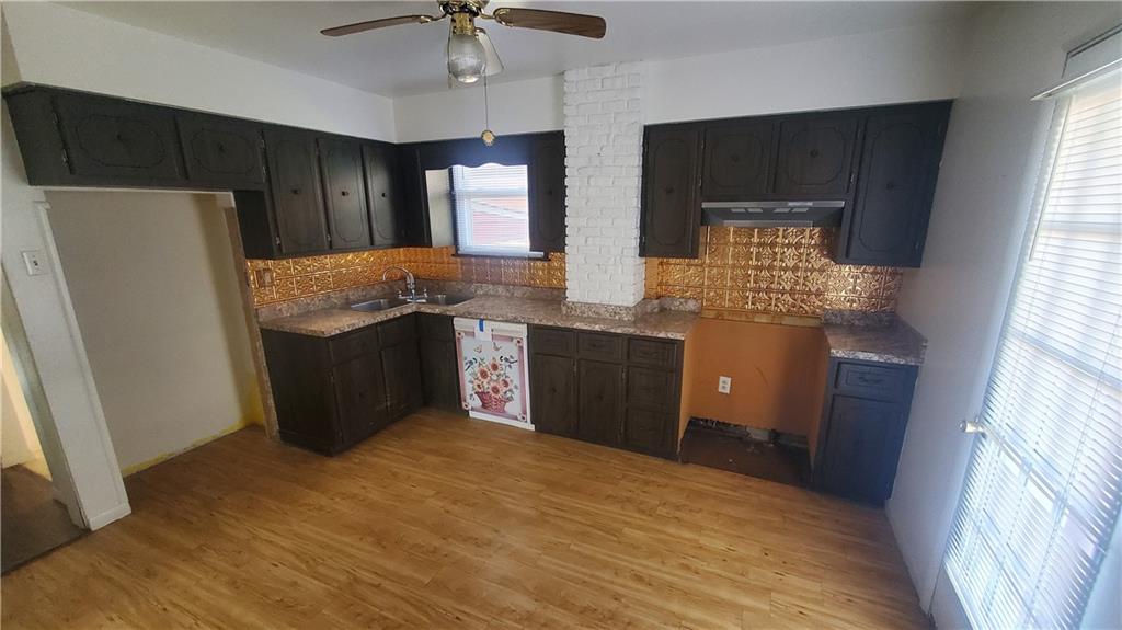 936 Ormond Street Brackenridge, PA 15014 - Photo 14 of 24 a kitchen with stainless steel appliances granite countertop a refrigerator a stove a sink and a microwave