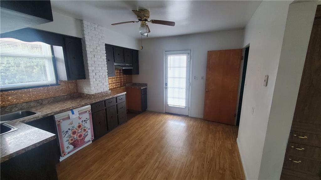 936 Ormond Street Brackenridge, PA 15014 - Photo 15 of 24 a kitchen with stainless steel appliances granite countertop a sink stove and refrigerator